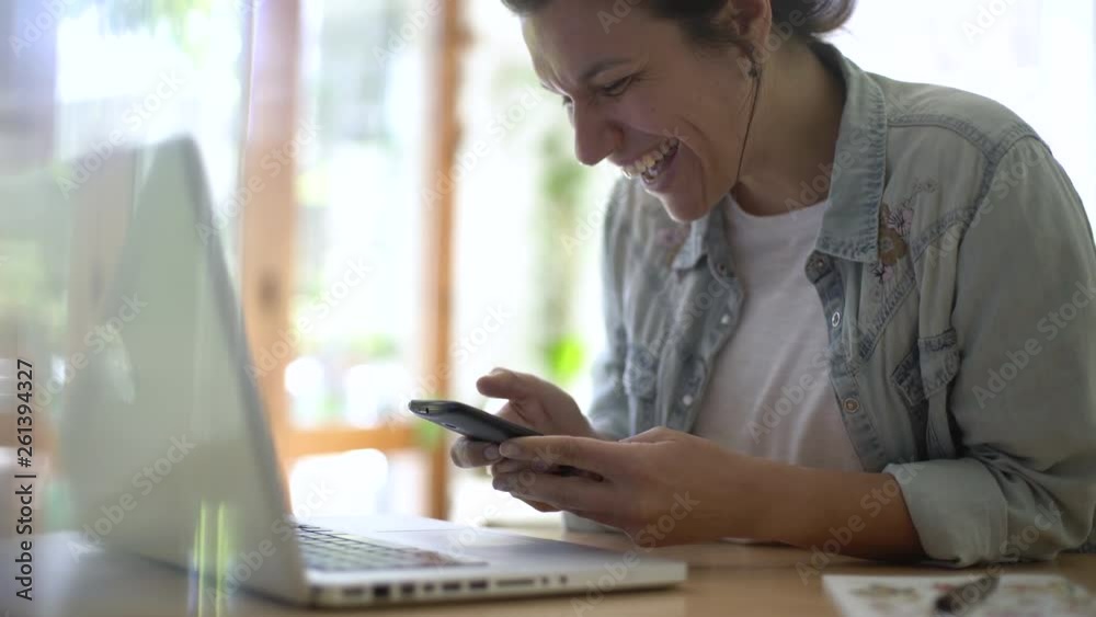 Medium shot of smiling mature woman texting on smart phone at home Medium shot of smiling mature woman texting on smart phone at home
