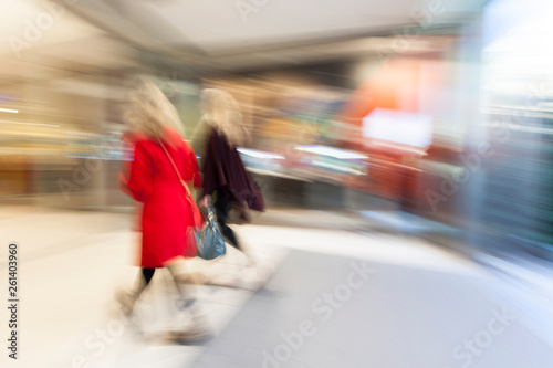 Blurred mall, people rushing through corridor, zoom effect