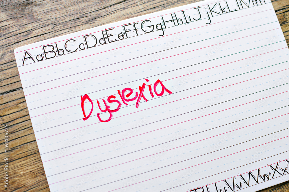 The word Dyslexia is written on a penmanship board in a classroom