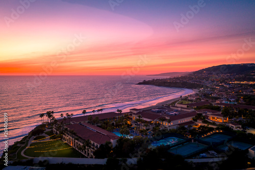 Aerial view over ocean in Dana Point, Orange County in Southern California after sunset during twilight.