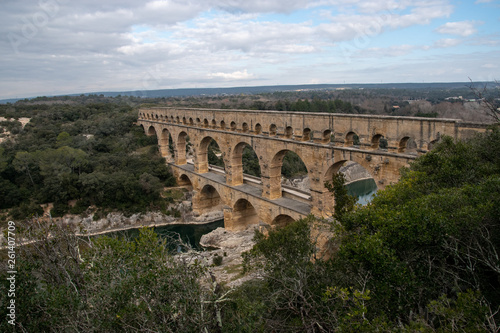 The Pont du Gard is an ancient Roman aqueduct that crosses the Gardon River near the town of Vers-Pont-du-Gard in southern France.