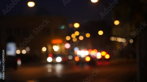 Defocused night traffic lights. Blur view of traffic in city at night. photo