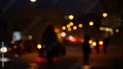 Defocused night traffic lights. Blur view of traffic in city at night. photo