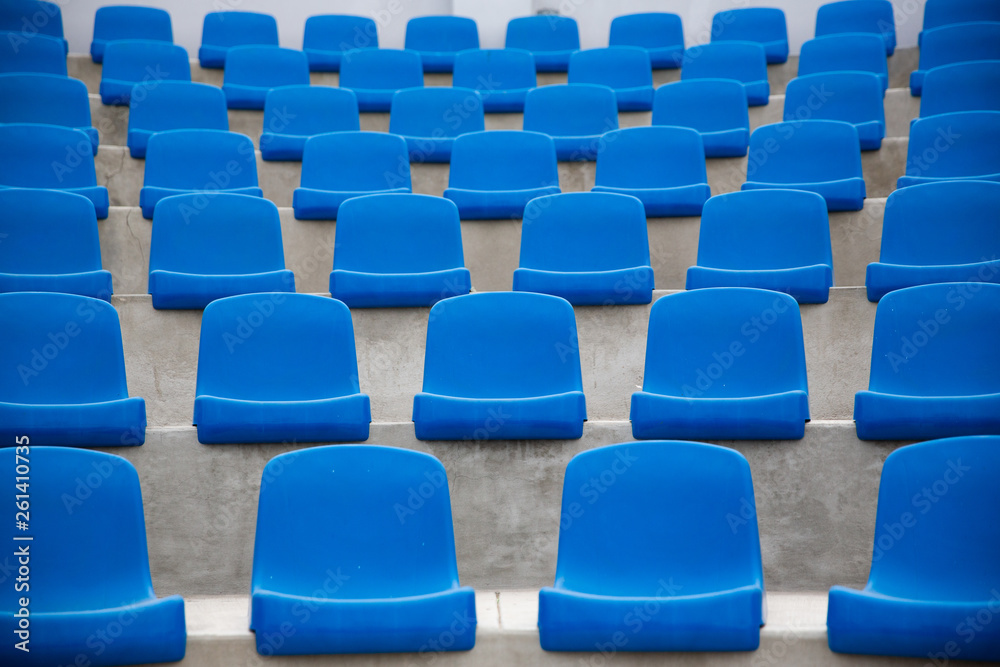 Tennis Court, empty blue seats. Tennis Court, empty blue seats.
