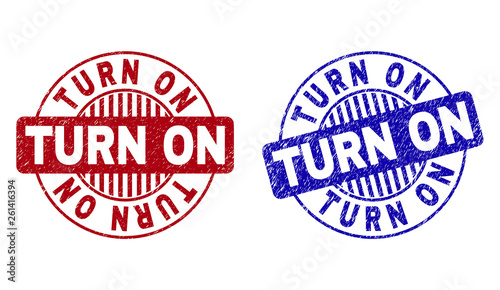 Grunge TURN ON round stamp seals isolated on a white background. Round seals with grunge texture in red and blue colors. Vector rubber imprint of TURN ON caption inside circle form with stripes.