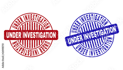 Grunge UNDER INVESTIGATION round stamp seals isolated on a white background. Round seals with grunge texture in red and blue colors.