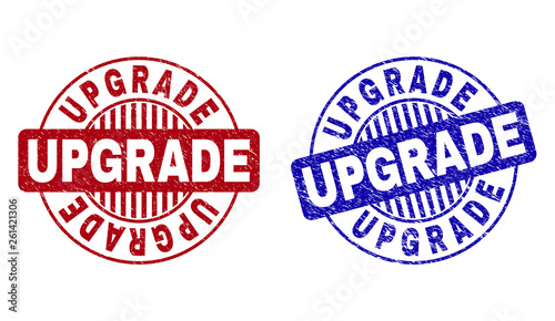 Grunge UPGRADE round stamp seals isolated on a white background. Round seals with grunge texture in red and blue colors. Vector rubber imprint of UPGRADE caption inside circle form with stripes.