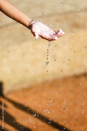 Water Pouring in Child s Hands