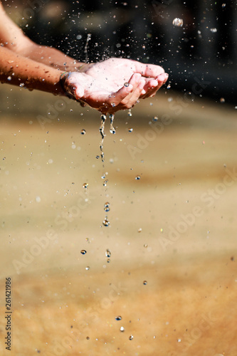 Water Pouring in Child's Hands