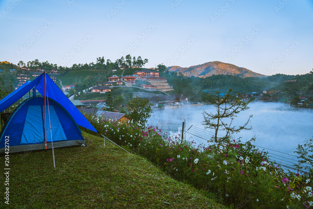The concept of setting up a mountain camp, Camping Tent, Travel relax. Landscapes, nature, fog touch at Thailand.