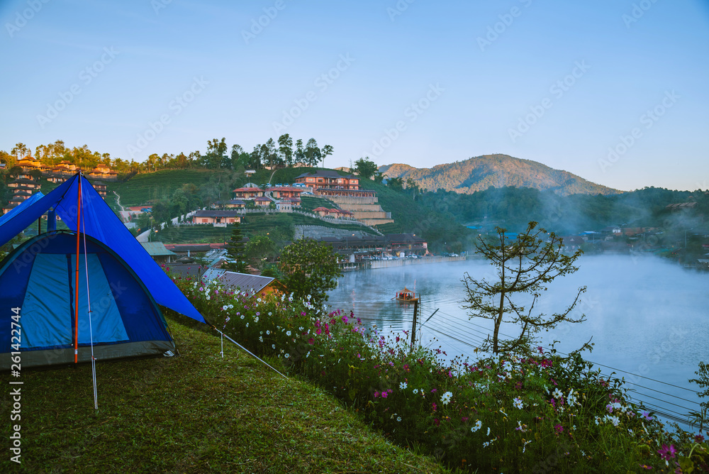 The concept of setting up a mountain camp, Camping Tent, Travel relax. Landscapes, nature, fog touch at Thailand.