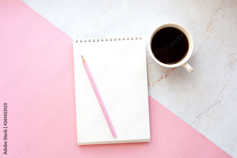 Business Workplace in a minimalist style with cup of coffee, notebook, pencil. Pink and marble background Business Workplace in a minimalist style with cup of coffee, notebook, pencil. Pink and marble background