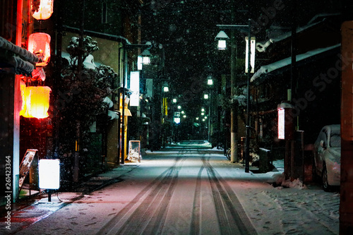 road at the night during snow fall at takayama Japan
