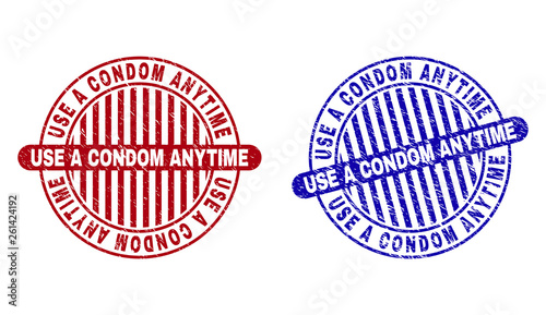 Grunge USE A CONDOM ANYTIME round stamp seals isolated on a white background. Round seals with grunge texture in red and blue colors.