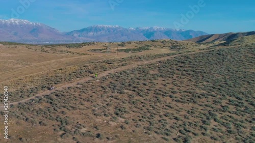 Aerial Footage of Dirt Bike Motorcycles Climbing a Mountain 