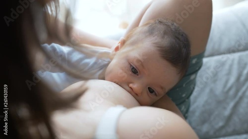Breast feeding, breastfeeding concept. Happy Mother feeding her Newborn baby.