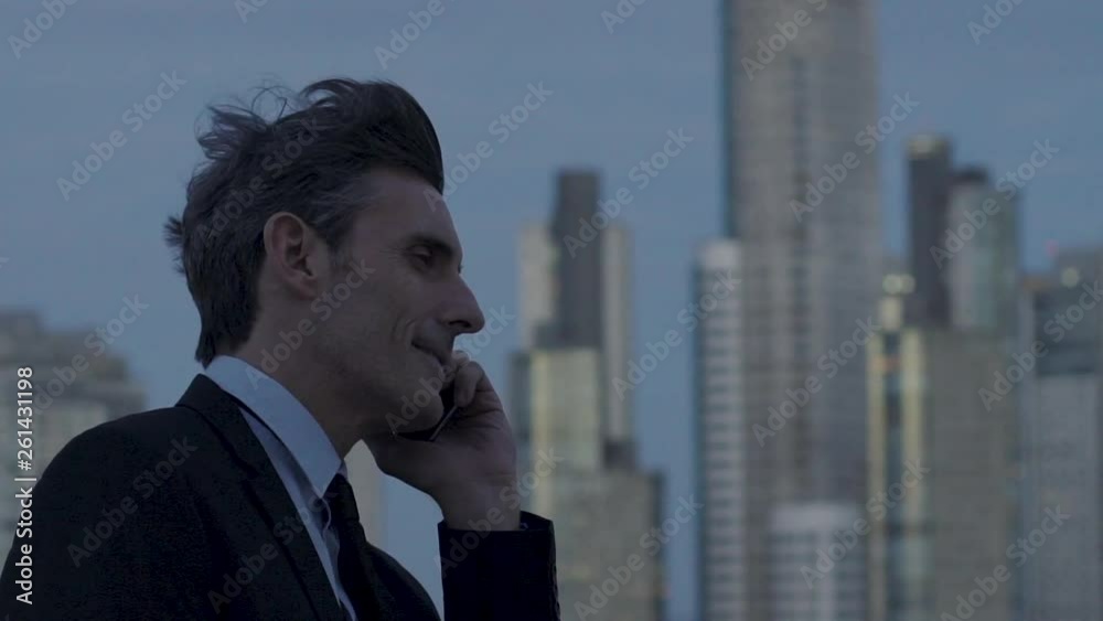 Close-up shot of mature businessman talking on smartphone outdoors Close-up shot of mature businessman talking on smartphone outdoors