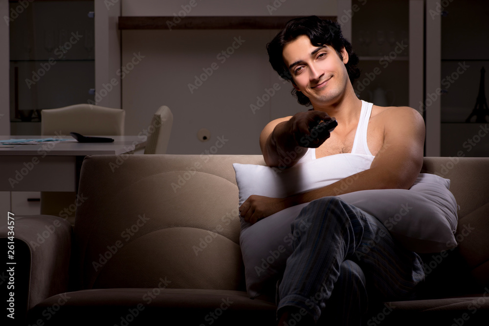 Young man suffering at home night time Young man suffering at home night time