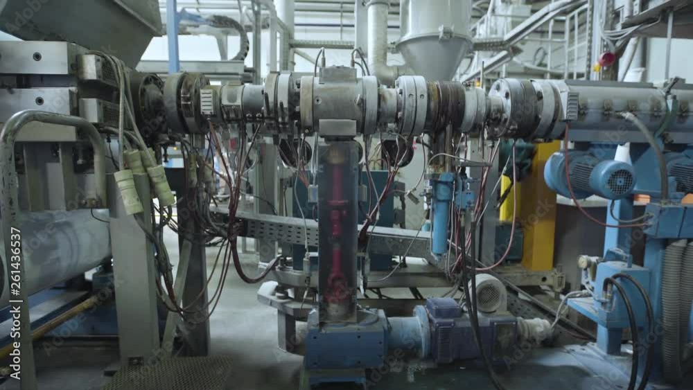 Medium shot of machine in paper cup factory Medium shot of machine in paper cup factory