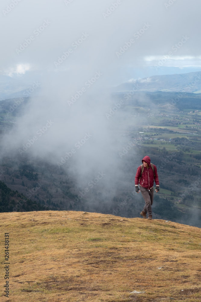 hiker on the top of mountain