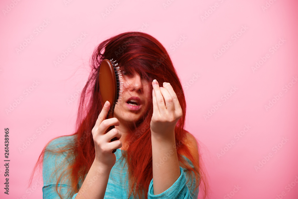 Woman with a comb and problem hair Woman with a comb and problem hair