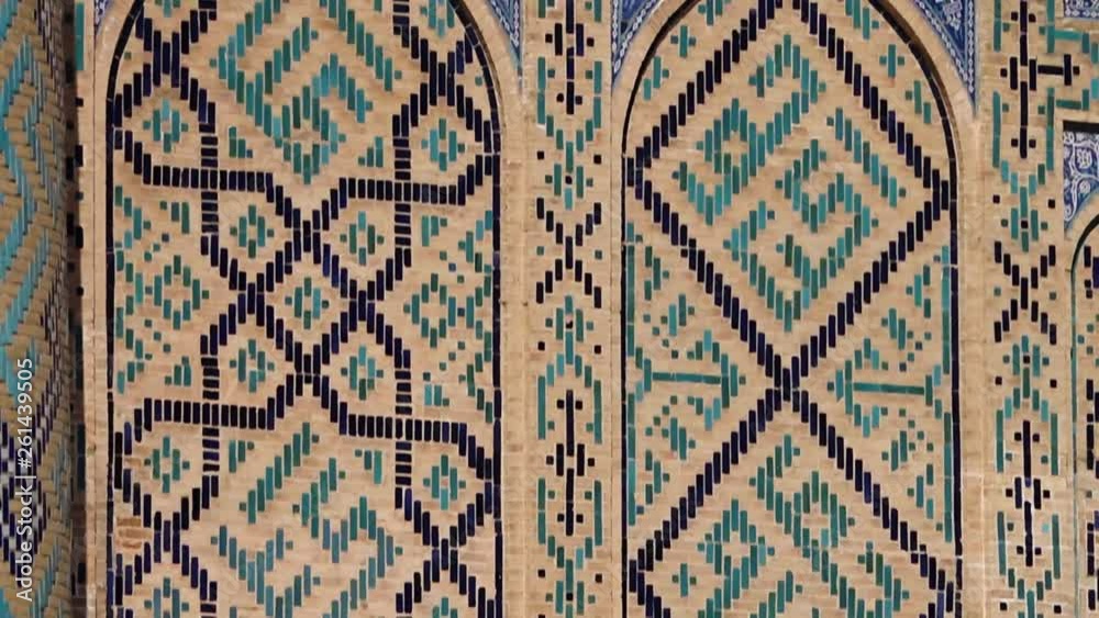 Handheld, tilting, medium close up shot of edifice designs on archway walls. Handheld, tilting, medium close up shot of edifice designs on archway walls.