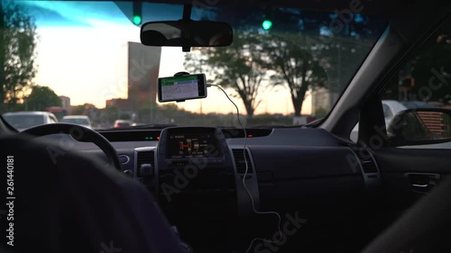 Atlanta, USA - April 5, 2019 : a trip to the city with uber. Situation inside uber car sitting behind the driver.