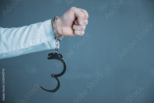 man hand handcuffs photo