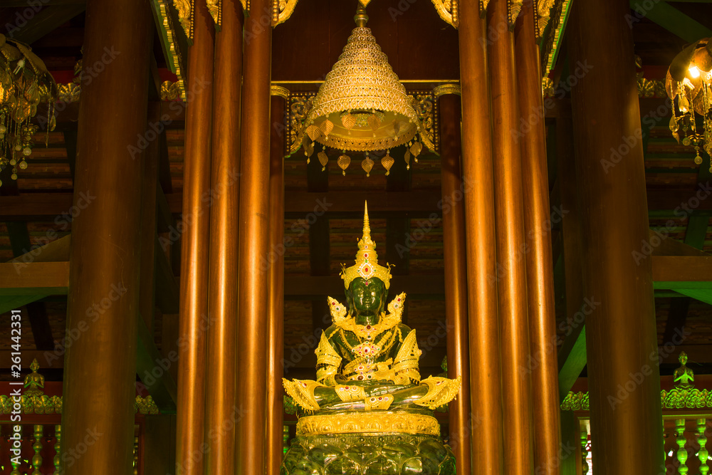Fototapeta premium Ancient statue of the Emerald Buddha in a Buddhist temple Wat Phra Kaew