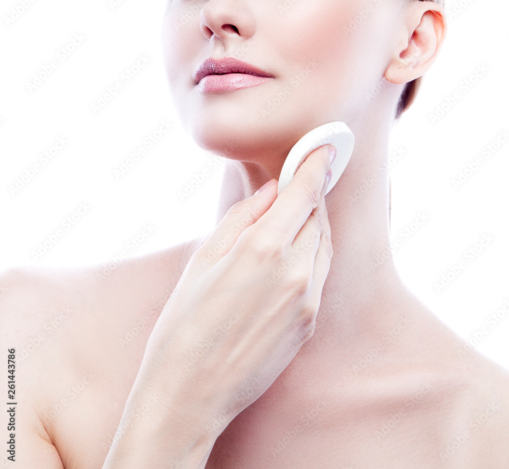 Woman part of face and body. Beauty treatment, remove make-up cosmetics with cotton sponge Woman part of face and body. Beauty treatment, remove make-up cosmetics with cotton sponge