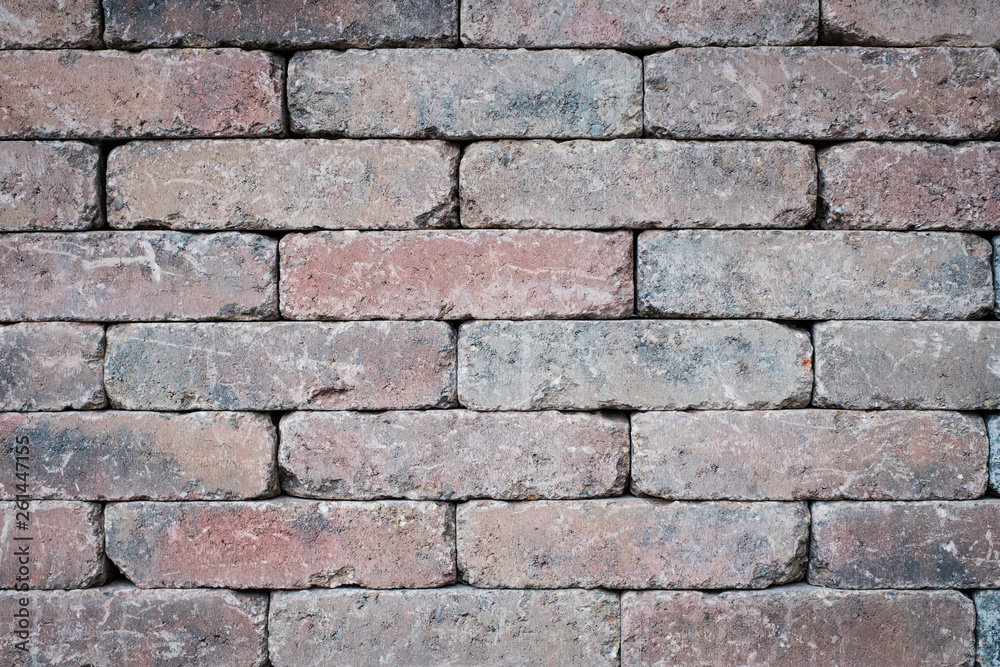 Fototapeta premium old brick wall closeup - tiled stone background