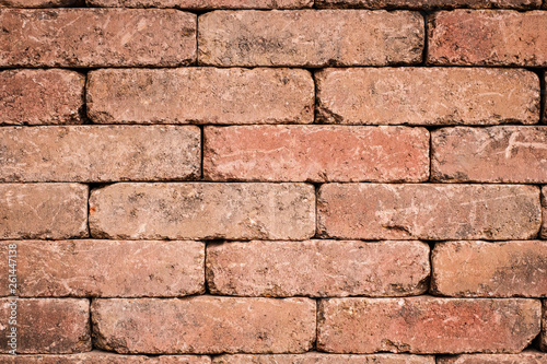 old brick wall closeup - tiled stone background
