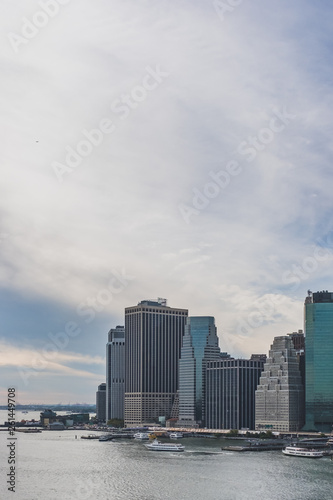 Skyscrapers of downtown Manhattan over East River  viewed from Brooklyn Bridge Park  in Brooklyn  New York  USA