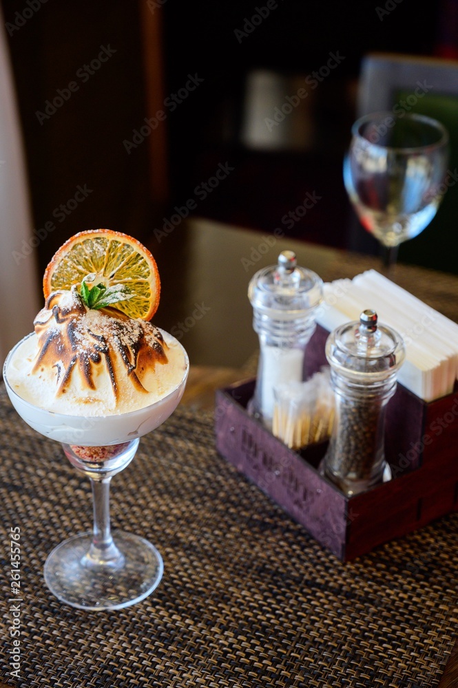 Ice cream with chocolate topping in a glass