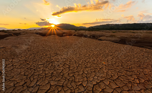 cracked earth near drying water on twilight at at Sam Pan Bok in Mekong river. Ubonratchathani Province ,Thailand