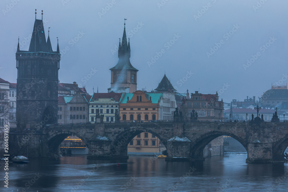 Aerial view of Charles Bridge and river at sunset time