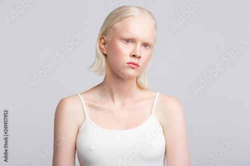 Women with white skin wearing camisole having strange face expression