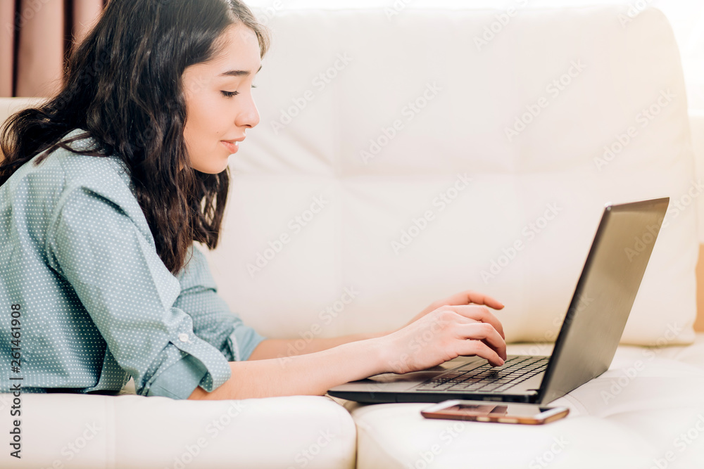 Bbeautiful woman using laptop computer at home on sofa Bbeautiful woman using laptop computer at home on sofa