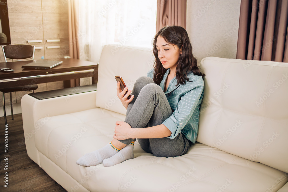 Young woman using smartphone at home Young woman using smartphone at home