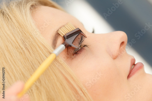 Woman brushing her eyelashes © anetlanda