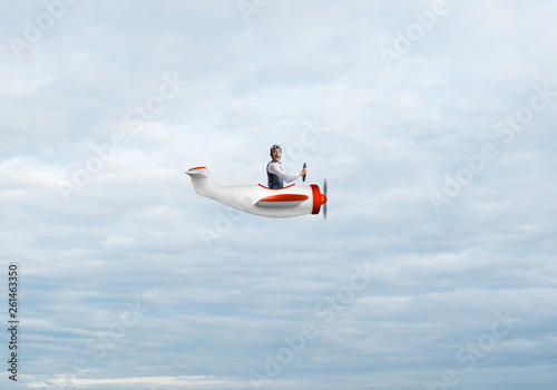 Happy pilot driving small propeller plane