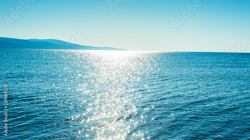 Photo of blue clear beach skyline, with blue clear sky in summer sunny day