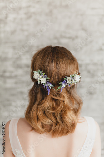 bridal hairstyle with a flower combs