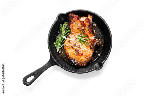 Canvastavla Fried pork steak in frying pan  isolated on white background.