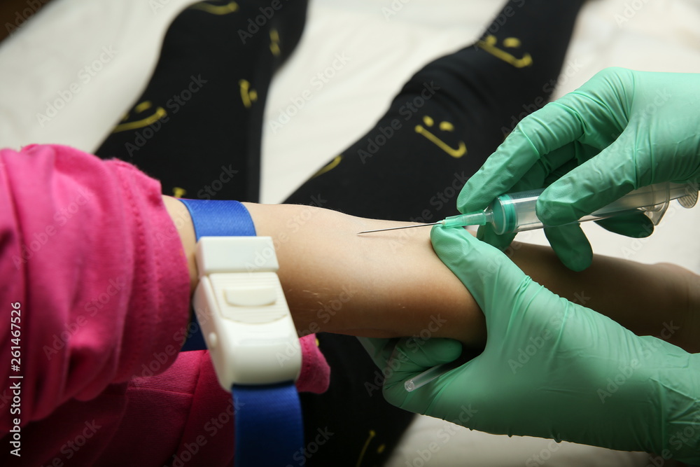 the doctor takes blood from the vein of the child. the child delivers blood from a vein. the doctor's hand gives a shot the child in the vein. the hand doctor inserts a needle syringe into the vein. the doctor takes blood from the vein of the child. the child delivers blood from a vein. the doctor's hand gives a shot the child in the vein. the hand doctor inserts a needle syringe into the vein.