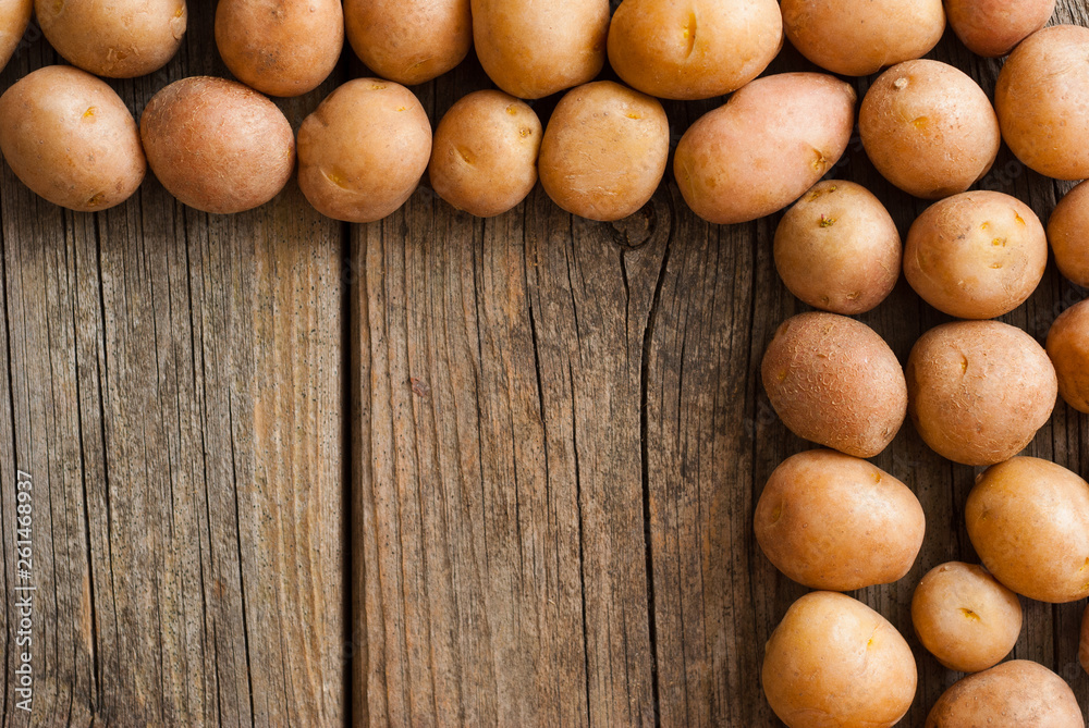 petite potatoes on rustic wood table background