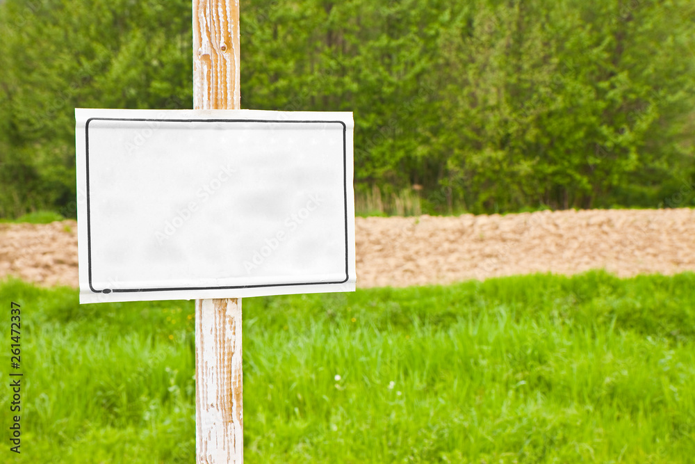 Wooden blank sign indicating in the countryside - image with copy space