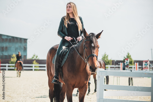 Spring - summer season, concept of hobby, Woman with a horse on a nature, relationship human and animals 