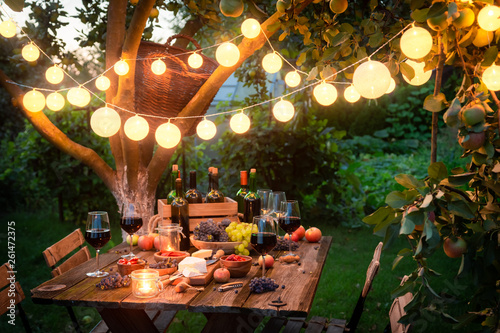 Canvas Rustic table with appetizers and wine in the evening