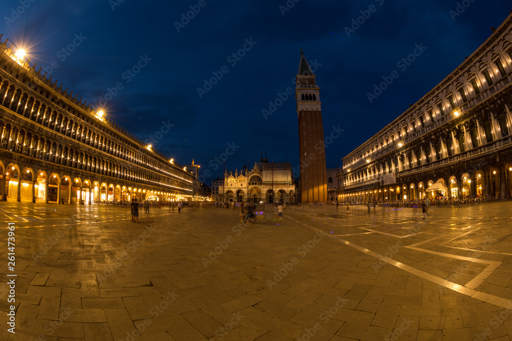 A view of St. Mark's Square with Campanile and Doge's Palace at sunset time